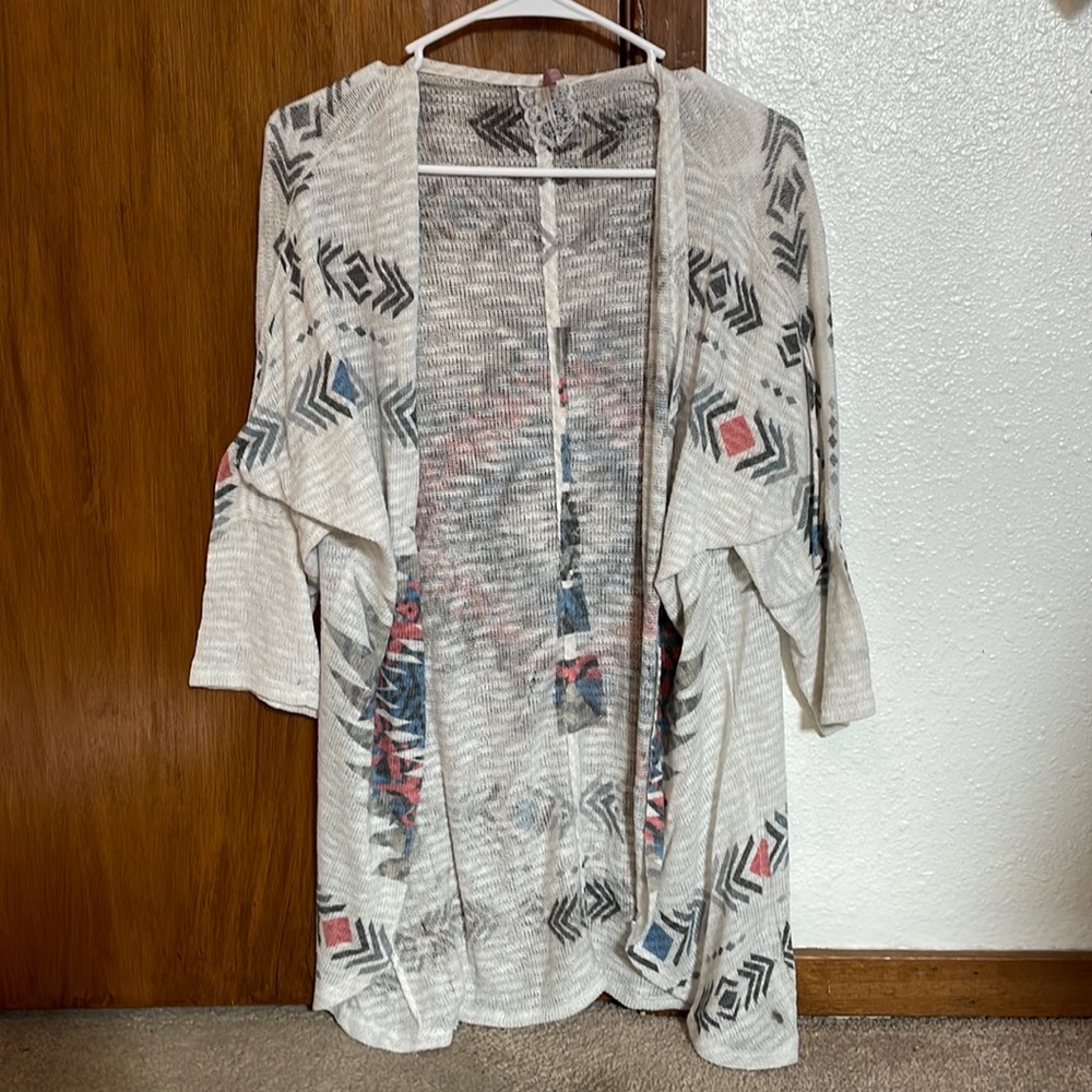 Mauve Aztec pattern cardigan.